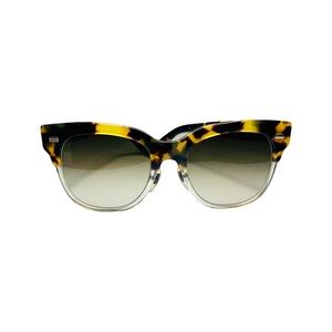 Gucci tortoiseshell sunglasses with silver hardware and brown gradient lenses.